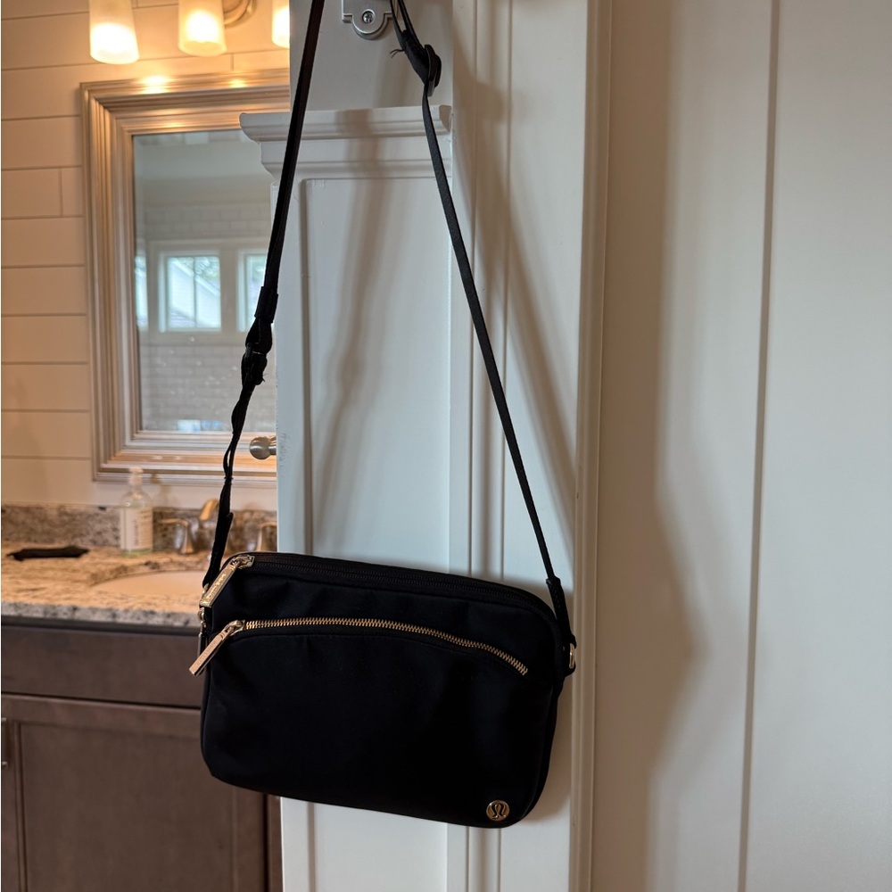 Lululemon Athletica Black Mini Bag with Gold Accents